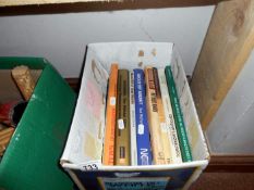 A box of books, mainly on toys