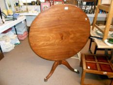 A Victorian tilt top table