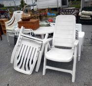 A large quantity of white garden chairs, a garden table etc