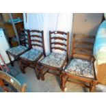 A set of 4 ladder back dining chairs