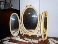 A triple dressing mirror