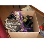 A box containing top hats & clths etc.
