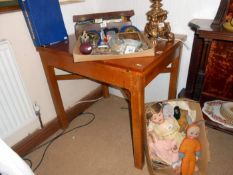 An oak dining table with swivel top