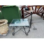 A metal framed, glass topped table etc