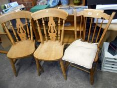 A pair of kitchen chairs and a stick back chair