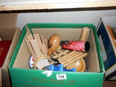 A box of small musical instruments