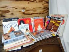 A large quantity of yoga and fitness books