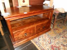 A teak cornet cabinet