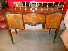 A serpentine fronted sideboard