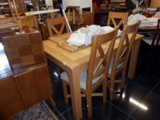 A quality draw leaf table and 4 chairs