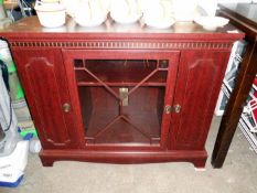 A mahogany corner cabinet