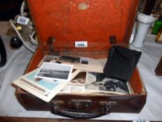 A small suitcase & photographs