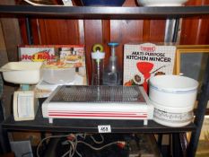 A shelf of kitchen equipment