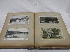 An album of approximately 300 old postcards, topographical,
