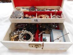 A white jewellery box of costume jewellery