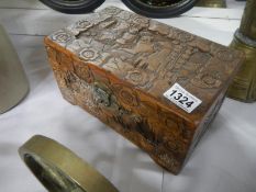 A heavily carved camphor wood box 26.5cm x 16cm x 13.