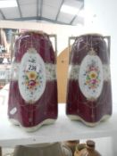 A pair of hand painted Japanese vases with flower garlands,