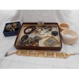 A box of assorted vintage jewellery including silver items