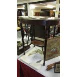 An Edwardian oval mahogany side table