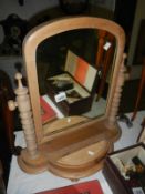 A stripped oak Victorian swing toilet mirror