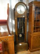 A 1930's oak long case clock with Westminster chime