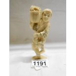 An antique ivory figure,