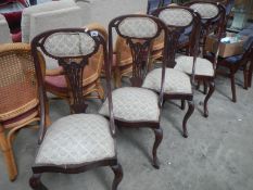 A set of 4 Edwardian mahogany Heppelwhite style chairs