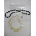 A vintage mother of pearl necklace and a lace agate necklace