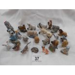 A quantity of miniature animal figures including Wade Disney & whimsies