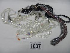 A mixed lot of crystal and other necklaces