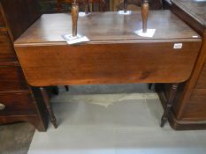 A Victorian mahogany Pembroke table with drawer