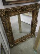 Gilt framed bevelled mirror