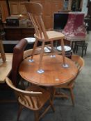 A round pine kitchen table & 4 chairs