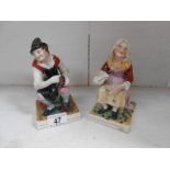 A pair of Staffordshire figures,