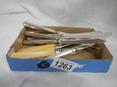 A set of 6 silver handled butter knives (HM Sheffield 1918/19) and a set of 6 silver collared