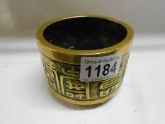 A 19th century Oriental bronze pot with embossed Chinese symbols