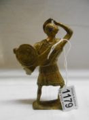 An old brass gladiator paperweight