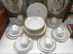 A 6 place setting white china dinnerware with gilded rims (30 pieces)