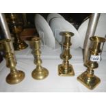 2 pairs of brass candlesticks