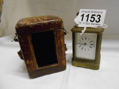 A small cased brass carriage clock (makers name worn from face)