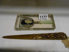 A French bronze paper knife signed H Boyer and a boxed Mid 20th century Chinese jade hand mirror