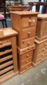 A pair of 3 drawer solid pine bedside chest of drawers