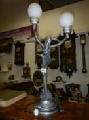 An art deco style twin lamp figural table lamp