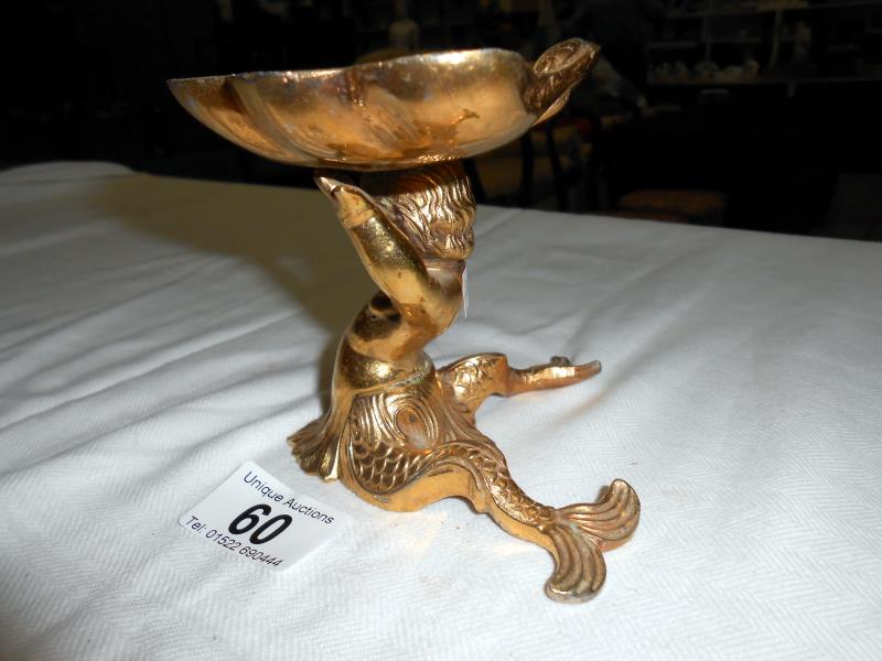 A solid brass dish surmounted by mermaid & a pair of brass candlesticks - Image 3 of 5