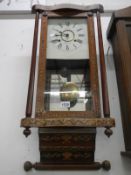 A Victorian inlaid wall clock