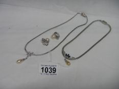 A Majorca pearl pendant with earrings and one other necklace