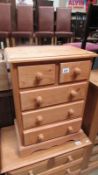 A small 2 over 3 chest of drawers