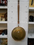 A copper & brass warming pan