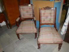 A pair of Edwardian armchairs