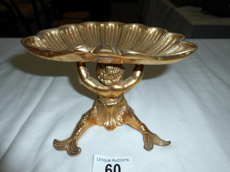 A solid brass dish surmounted by mermaid & a pair of brass candlesticks - Image 4 of 5